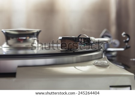 A vintage record player(turntable) with LP(record)