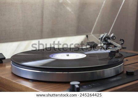 A vintage record player(turntable) with LP(record)
