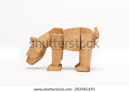 The wooden toy of bear for kids side view isolated white background at the studio.