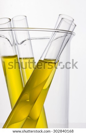 Test tube with yellow(urine) liquid(fluid, water) in the beaker for chemical, health, urology at the laboratory and white background.