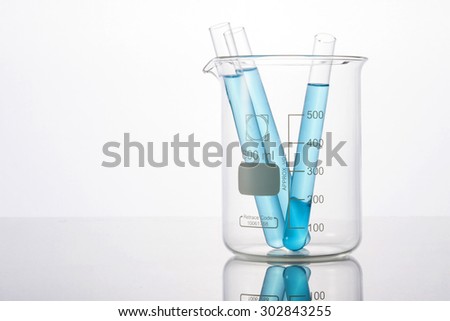 Test tube with blue(cyan) liquid(fluid, water) in the beaker for chemical, health at the laboratory and white background.