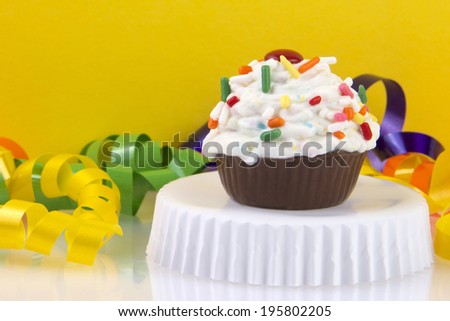 CupCake Candy Cake Ball with bright yellow orange background