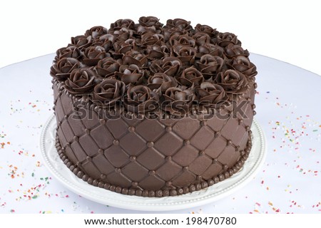 Chocolate Cake with handmade Chocolate frosting roses top angle view