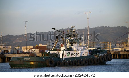 OAKLAND, CA - NOVEMBER 22, 2014: Marshall Foss tug boat, part of the Foss Maritime fleet. Foss is a leading company in ship assist and tanker escort services.