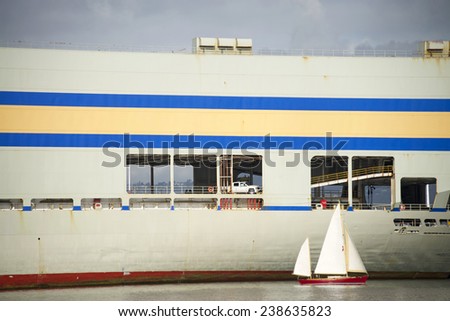 OAKLAND, CA - DECEMBER 18, 2014: Matson ships vehicles between the Mainland and Hawaii or Guam/Micronesia. Cars are driven onto the Ship MOKIHANA, parked in the structure at the stern of the vessel.