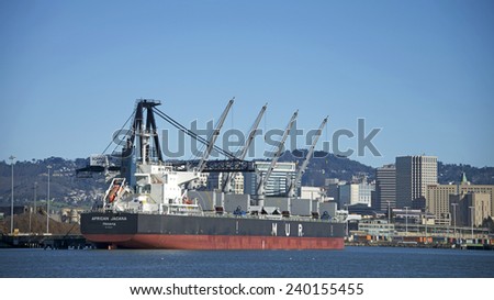 OAKLAND, CA - DECEMBER 26, 2014: MUR Shipping Bulk Carrier AFRICAN JACANA docked at Schnitzer Steel at the Port of Oakland.