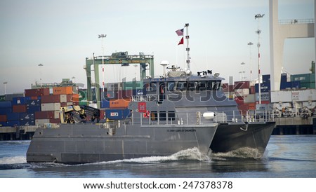 OAKLAND, CA - JANUARY 26, 2015: U.S. Army Corps of Engineers vessel in the inner harbor of the Port of Oakland. The U.S. Army Corps of Engineers provides public engineering services in peace and war.