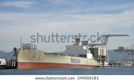 OAKLAND, CA - FEBRUARY 01, 2015: Matson Cargo Ship MATSONIA remains empty, docked at the Port of Oakland along the Inner Harbor. Matson provides shipping services Pacific-wide.