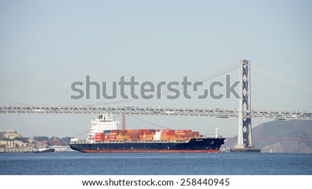 OAKLAND, CA - MARCH 05, 2015: Liberian Container Ship SANTA RAFAELA entering the Port of Oakland. The Port of Oakland loads and discharges over 99 percent of cargo moving through Northern California.