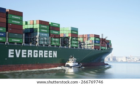 OAKLAND, CA - APRIL 04, 2015:  Evergreen Cargo Ship EVER LOGIC departing the Inner Harbor heading towards the Outer Harbor at the Port of Oakland.