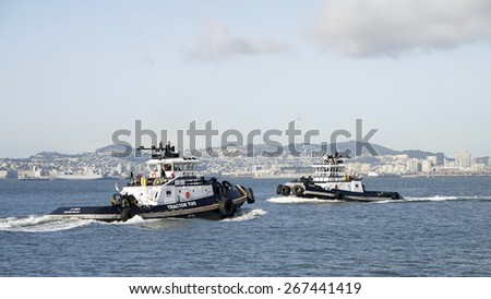 OAKLAND, CA - APRIL 06, 2015: Tugboat Z-FIVE and Z-FOUR pass each other in the San Francisco Bay as Z-FIVE enters and Z-FOUR is exiting the Middle Harbor at the Port of Oakland.