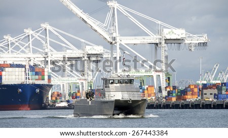 OAKLAND, CA - APRIL 06, 2015: U.S. Army Corps of Engineers vessel in the inner harbor of the Port of Oakland. The U.S. Army Corps of Engineers provides public engineering services in peace and war.