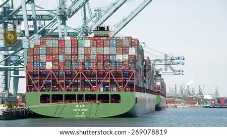 SAN PEDRO, CA - APRIL 10, 2015: China Shipping Cargo Ship XIN YA ZHOU loading at the Port of Los Angeles. The Port of LA is the busiest container port in the United States.