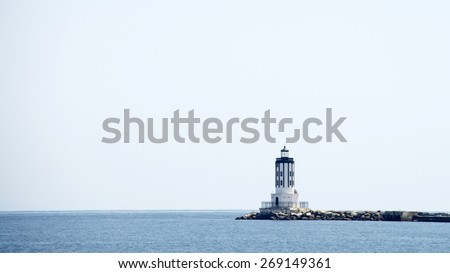 SAN PEDRO, CA - APRIL 10, 2015: Port of Los Angeles. The Los Angeles Harbor Light, also known as Angels Gate Light, at San Pedro Breakwater in LA Harbor, California. Fully Automated since 1971.