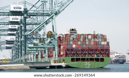 SAN PEDRO, CA - APRIL 10, 2015: China Shipping Ship XIN YA ZHOU loading at the Port of Los Angeles. The Port of LA is located in the San Pedro Bay, is the busiest container port in the United States.