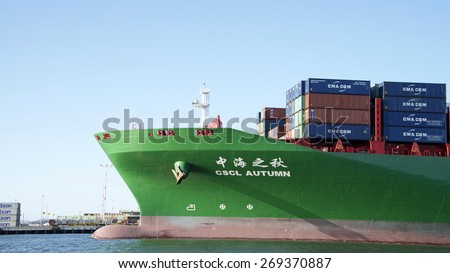 OAKLAND, CA - APRIL 12, 2015: China Shipping Line Cargo Ship CSCL AUTUMN departing the Port of Oakland. China Shipping Container Line is the seventh largest global container shipping liner by capacity
