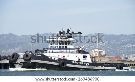 OAKLAND, CA - APRIL 13, 2015: Tugboat Z-THREE at the Port of Oakland. Tug boats move vessels that can not or should not move themselves, such barge vessels and ships in a crowded harbor.