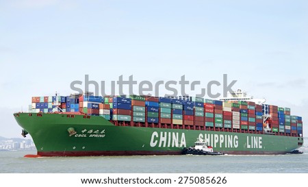 OAKLAND, CA - MAY 03, 2015: China Shipping Lines Cargo Ship CSCL SPRING entering the Port of Oakland. The Port of Oakland is the fifth busiest container port in the United States.
