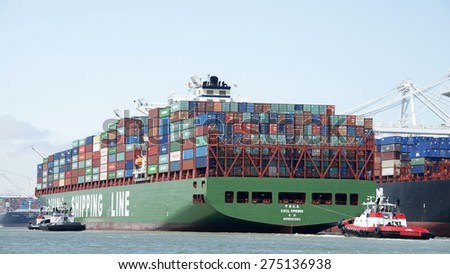 OAKLAND, CA - MAY 03, 2015:  China Shipping Lines Cargo Ship CSCL SPRING entering the Port of Oakland. The Port of Oakland is the fifth busiest container port in the United States.