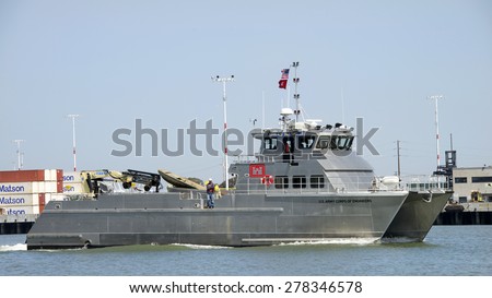 OAKLAND, CA - MAY 06, 2015: U.S. Army Corps of Engineers Vessel JOHN A.B. DILLARD JR  traveling through the middle harbor past the Port of Oakland..