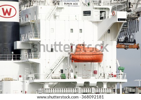 OAKLAND, CA - JANUARY 25, 2016: 25 person Lifeboat aboard the BUNUN ACE. One of the most important life-saving equipments onboard a ship, used at the time of extreme emergencies for abandoning ship.