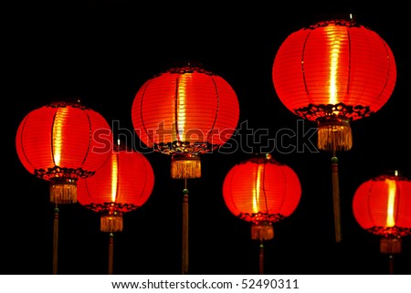 Big red lanterns will bring good luck and peace to prayer. It was at night in a chinese temple during Chinese New Year.
