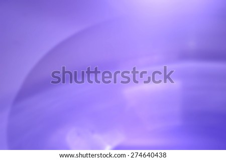 Blurred purple and white electric fan background scene.