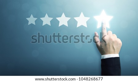 Hand of businessman touching five star symbol to increase rating of company concept, Copy space background for your title