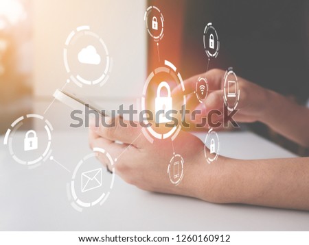 Woman using smartphone with icon graphic cyber security network of connected devices and personal data information