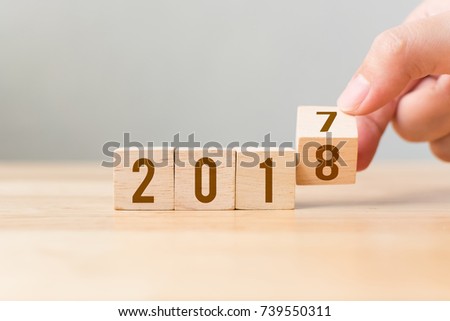 New year 2017 change to 2018 concept, Hand flip wood cube