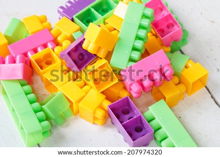 Plastic building blocks on table