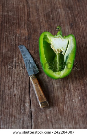 cut bell pepper on old wood background prepare for cook