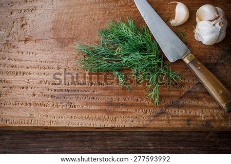organic dill with garlic prepare for cook, rustic food put on wooden cutting board