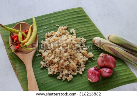 subterranean ant egg put on banana leaf with herb ingredient for cook Esan food, Lao food (local food)