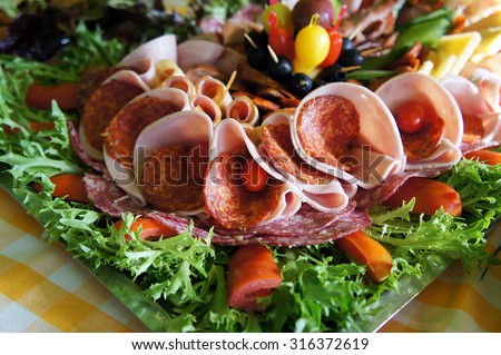 Assorted fresh cold cut platter - sausage, served as a cold buffet
