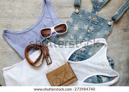 Overhead of essentials of a modern woman. Outfit of casual woman.