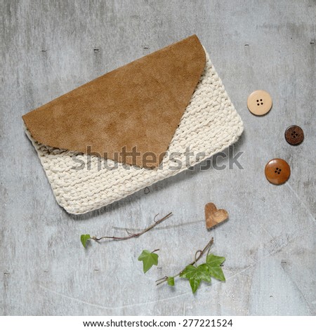 Fashion Leather Bags on grunge concrete background clutch handmade wooden background with buttons