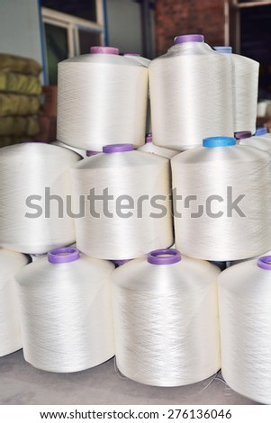 Many weave yarn axis piled up in factories