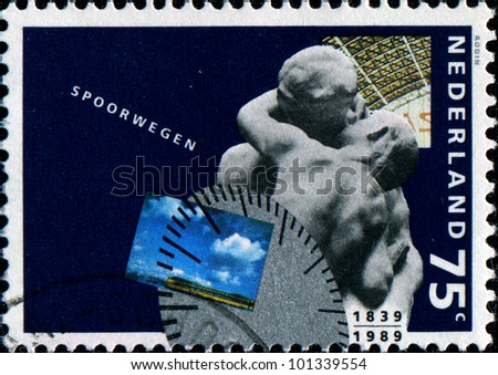 NETHERLANDS - CIRCA 1991: A stamp printed in Netherlands honoring 	150th Anniv of Netherlands\' Railways, shows Diesel train, station clock and The Kiss (sculpture by Rodin), circa 1991