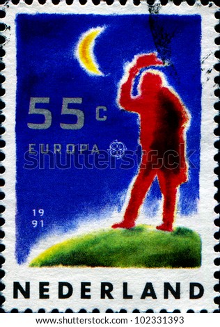 NETHERLANDS - CIRCA 1991: A stamp printed in Netherlands shows Europe in Space, Man in hat into space, circa 1991
