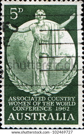 AUSTRALIA - CIRCA 1962: A stamp printed in Australia honoring Associated Country Women of the World Conference, shows woman on background of globe, circa 1962