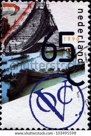 NETHERLANDS - CIRCA 1990: A stamp printed in Netherlands honoring 3rd Anniversary of Dutch East India Company Ships Association (replica ship project) (1579), shows Construction of Indiaman and Wreck