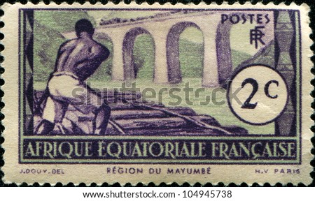 FRENCH EQUATORIAL AFRICA - CIRCA 1938: A stamp printed in French Equatorial Africa (now Gabon) shows Logging near Mayumba, circa 1938