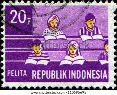 INDONESIA-CIRCA 1960: A stamp printed in Indonesia shows students in the classroom, circa 1960