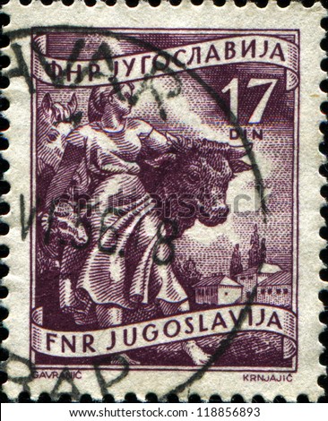 YUGOSLAVIA - CIRCA 1950: A stamp printed in Yugoslavia shows  Woman and farm animals, circa 1950