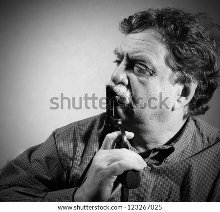 middle aged man with a revolver