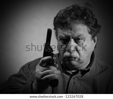 middle aged man with a revolver