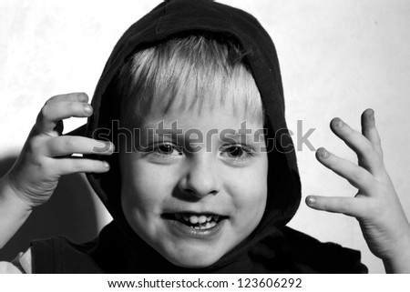 black and white photo of Laughing boy in the hood