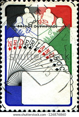 NETHERLANDS - CIRCA 1980: A stamp printed in  Netherlands shows Bridge Players, Netherlands Hand, 6th Bridge Olympiad, Valkenburg, circa 1980