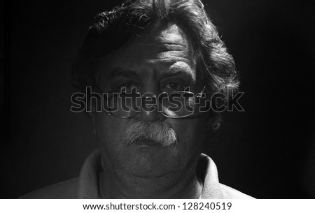 low key portrait of  middle-aged man, black and white